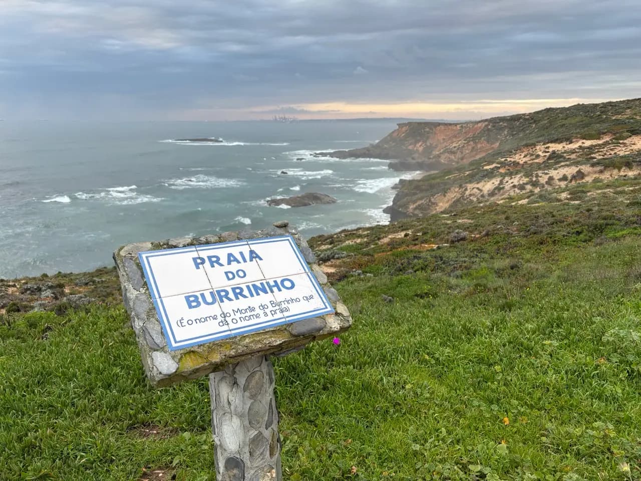Coastal trail sign near the water