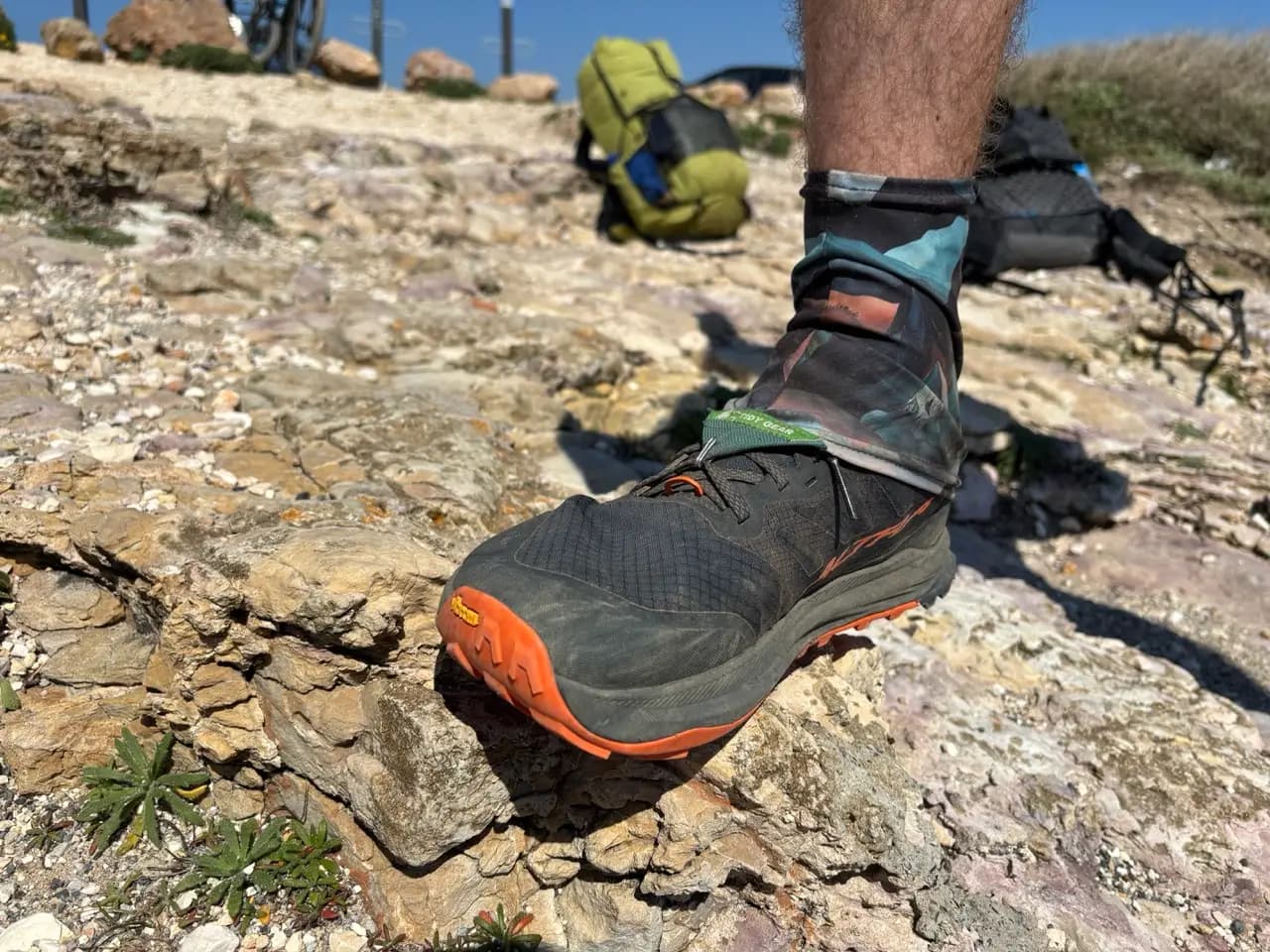 Trail runner with a gaiter attached to keep sand out on the Fishermen's Trail