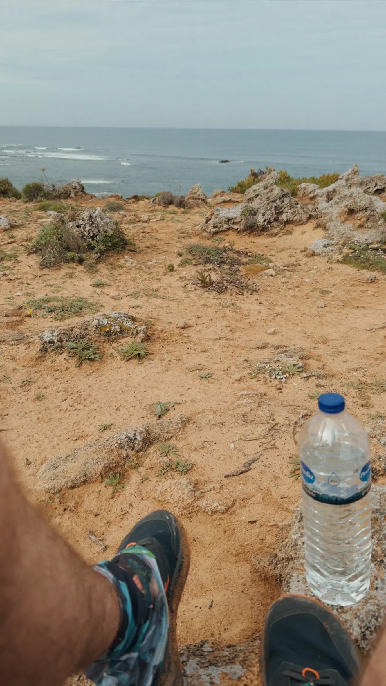 Trail runners on sandy coastal terrain of the Fishermen's Trail in Portugal