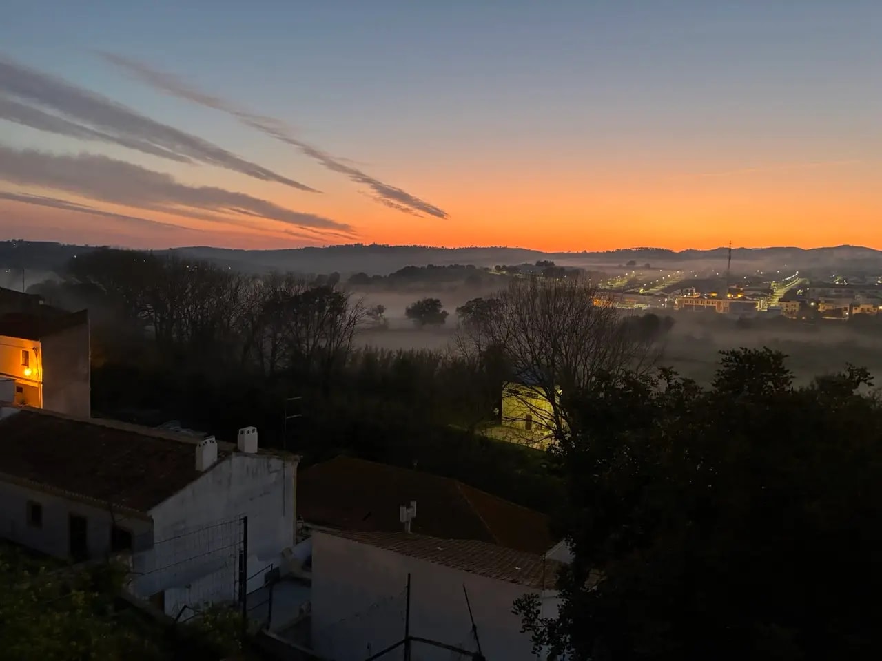 Early morning sunrise over Aljezur with mist rolling through the valley Early morning sunrise over Aljezur with mist rolling through the valley